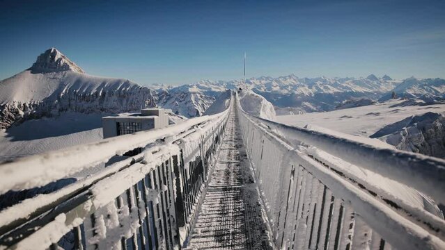Peak Walk is a pedestrian suspension bridge linking two mountain peaks in the Swiss Alps on an altitude of 3000 meters. Steadicam shot