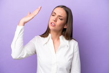 Young caucasian woman isolated on purple background with tired and sick expression