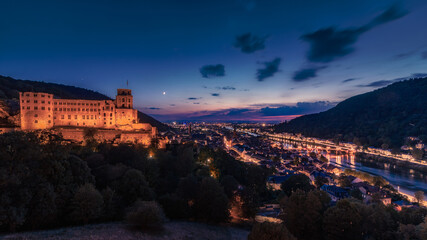Heidelberg Castle at Night with view on Oldtown and old Bridge