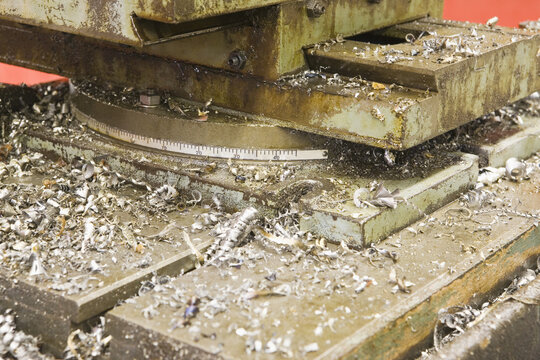 Close-up of a machine with metal shavings