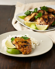 Grilled chicken thighs with lime and cilantro over rice.