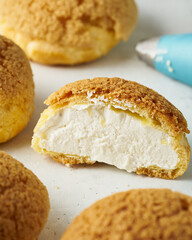 Choux pastry with a crisp crust and cream filling.