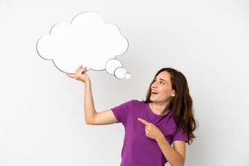 Young caucasian woman isolated on white background holding a thinking speech bubble and pointing it