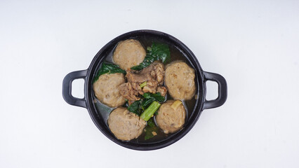 Indonesian Food - Bakso or Meatball. Prepared and served in a wok. isolated on white background. Flat lay concept