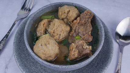 Traditional meatballs from Indonesia, served in bowl. selected focus