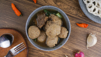 Beef meatballs served in bowl wooden background. Top View. Indonesia Traditional Food
