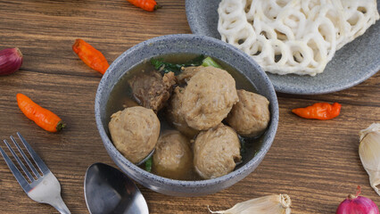 Beef meatballs served in bowl wooden background. Top View. Indonesia Traditional Food. selective focus