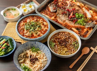 Assorted Spicy Grilled Fish, Pork Maocai, Hot and Sour Rice Noodles, Chongqing Small Noodles served in dish isolated on table top view of taiwan food