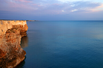 Fototapeta na wymiar Sunrise colours at Polignano a Mare resort in Puglia, Italy, Europe 