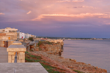 Fototapeta premium Sunrise colours over Polignano a Mare resort in Puglia, Italy, Europe 
