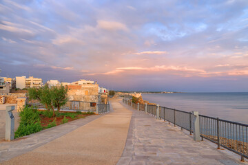 Sunrise colours over Polignano a Mare resort in Puglia, Italy, Europe
