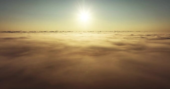 Beautiful sunrise over cloud Drone view camera mover over cloud background 