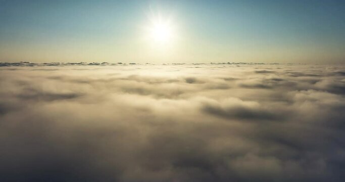 Beautiful sunrise over cloud Drone view camera mover over cloud background 
