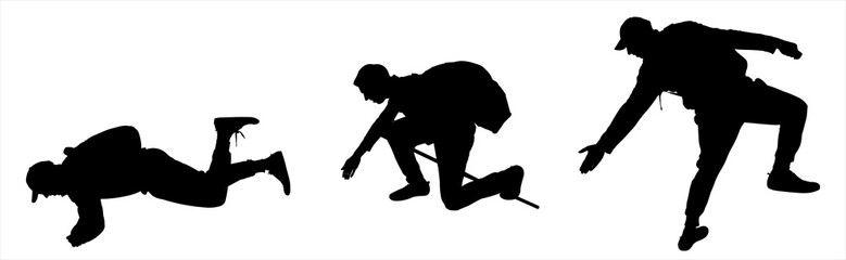 A guy with a backpack behind his back lies on his stomach, lowers his hand low, and provides assistance. Side view, profile. Rescuer. Rescuers lend a helping hand. Black silhouettes isolated on white