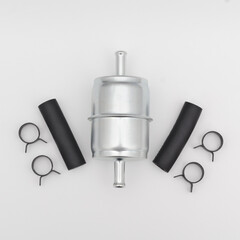 Flat lay view of an inline fuel filter and hardware