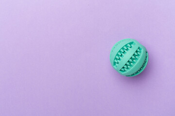 Blue ball toy for dogs on color background