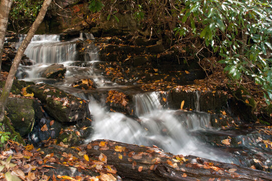 A stream gently cascading over rocks above Soco Falls.; Soco Falls, Cherokee, North Carolina.