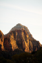Incredible mountain view landscapes in the valley at Zion National Park in Utah United States. There are amazing colors of orange and yellows at all times of the day.