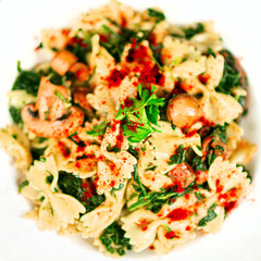 Farfalle pasta with mushrooms and spinach