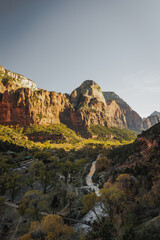 Incredible mountain view landscapes in the valley at Zion National Park in Utah United States. There are amazing colors of orange and yellows at all times of the day.