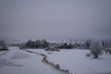 winter landscape taken from bridge over Vircava river near Jelgava town in Latvia. Bypass road to...
