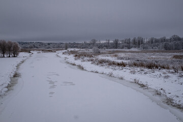 winter landscape taken from bridge over Vircava river near Jelgava town in Latvia. Bypass road to...