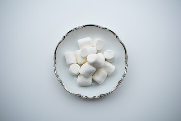 Marshmallows in fancy white and silver bowl