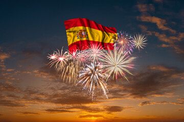 Flag of Spain and Holiday fireworks in sky