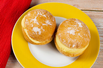 Sweet Bread with Boston cream and sugar, Brazilian donut called "bakery dream", or berlin ball.