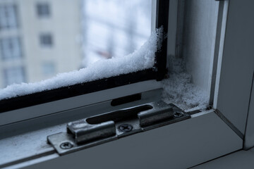 Room warming. The plastic window protects from bad weather. Snow on the window