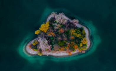 Aerial view of a small island on the lake  - 554332307