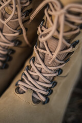 High-top lace-up sneakers in military color. Tactical army specialized sneakers for field conditions