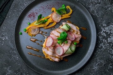 Bruschetta with roast beef on dark plate top view