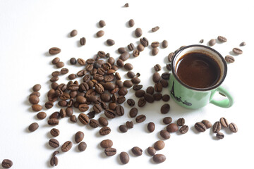 Cup of coffee with coffee beans.