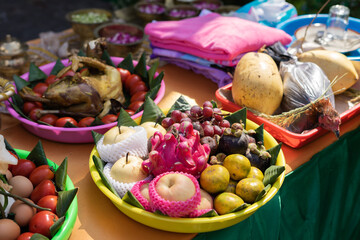 Obraz na płótnie Canvas Selective focus of various colorful food include fruits, vegetables, and chicken decorated for Siraman in traditional Javanese wedding ritual.