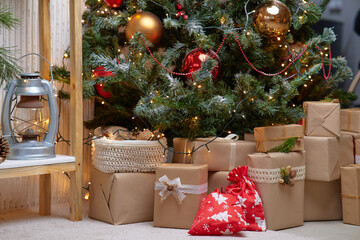 Many beautiful gift boxes under Christmas tree
