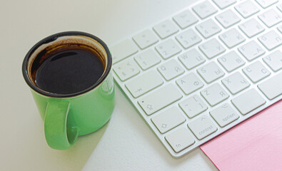 Cup of coffee with keyboard.