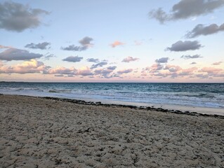 Lilac, green and sky blue sunset at the caribbean beach