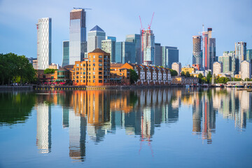 Fototapeta na wymiar London cityscape Canary Wharf with reflection from Greenland Dock in England