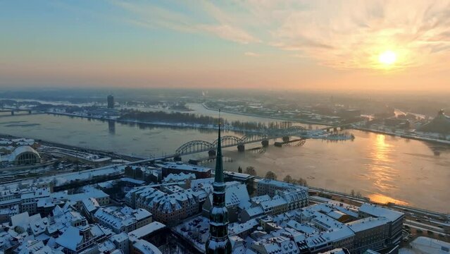 Beautiful sunset over winter Riga, Latvia. Aerial view of the old town near river Daugava. Winter in Latvia.