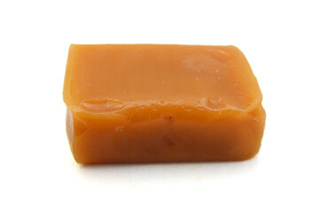 Caramel candies isolated on white background