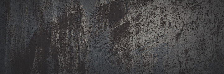 Old rusted metal texture. Rusty iron wall. Rough faded metal surface with spots, noise and grain. Dark wide panoramic background for grunge design. Shaded vintage texture with vignette.