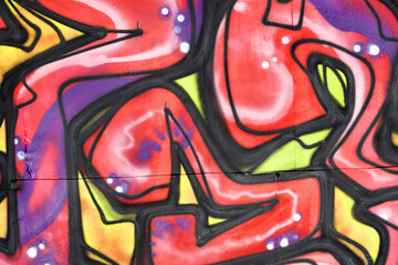 Colorful background of graffiti painting artwork with bright aerosol strips and beautiful colors....