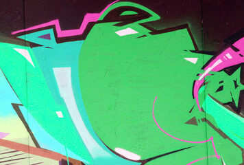 Colorful background of graffiti painting artwork with bright aerosol strips on metal wall. Old...