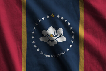 Mississippi new US state flag with big folds waving close up under the studio light indoors. The...