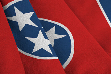 Tennessee US state flag with big folds waving close up under the studio light indoors. The official symbols and colors in fabric banner - obrazy, fototapety, plakaty