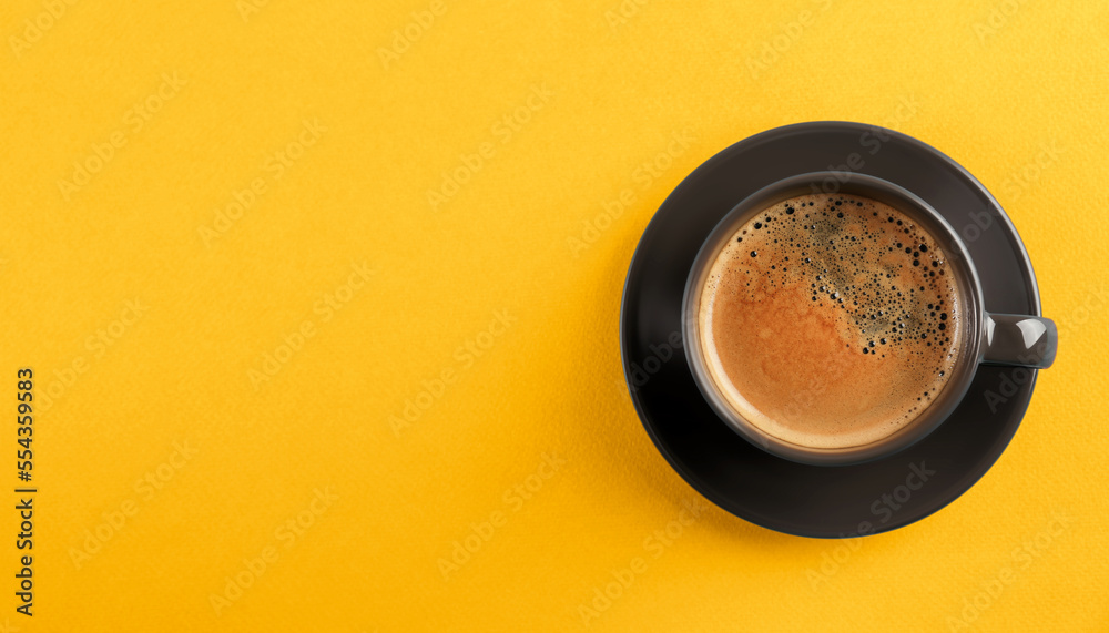 Poster Aromatic coffee in dark grey cup on yellow background, top view with space for text. Banner design