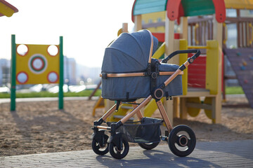 Baby stroller on the playground