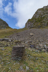 Col de Lurien mountain pass in Pyrenees mountains with field of stones and cuboid shaped stone on a...