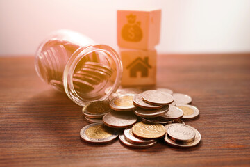 Coins in a jar, close-up, money saving concept (spot focus)